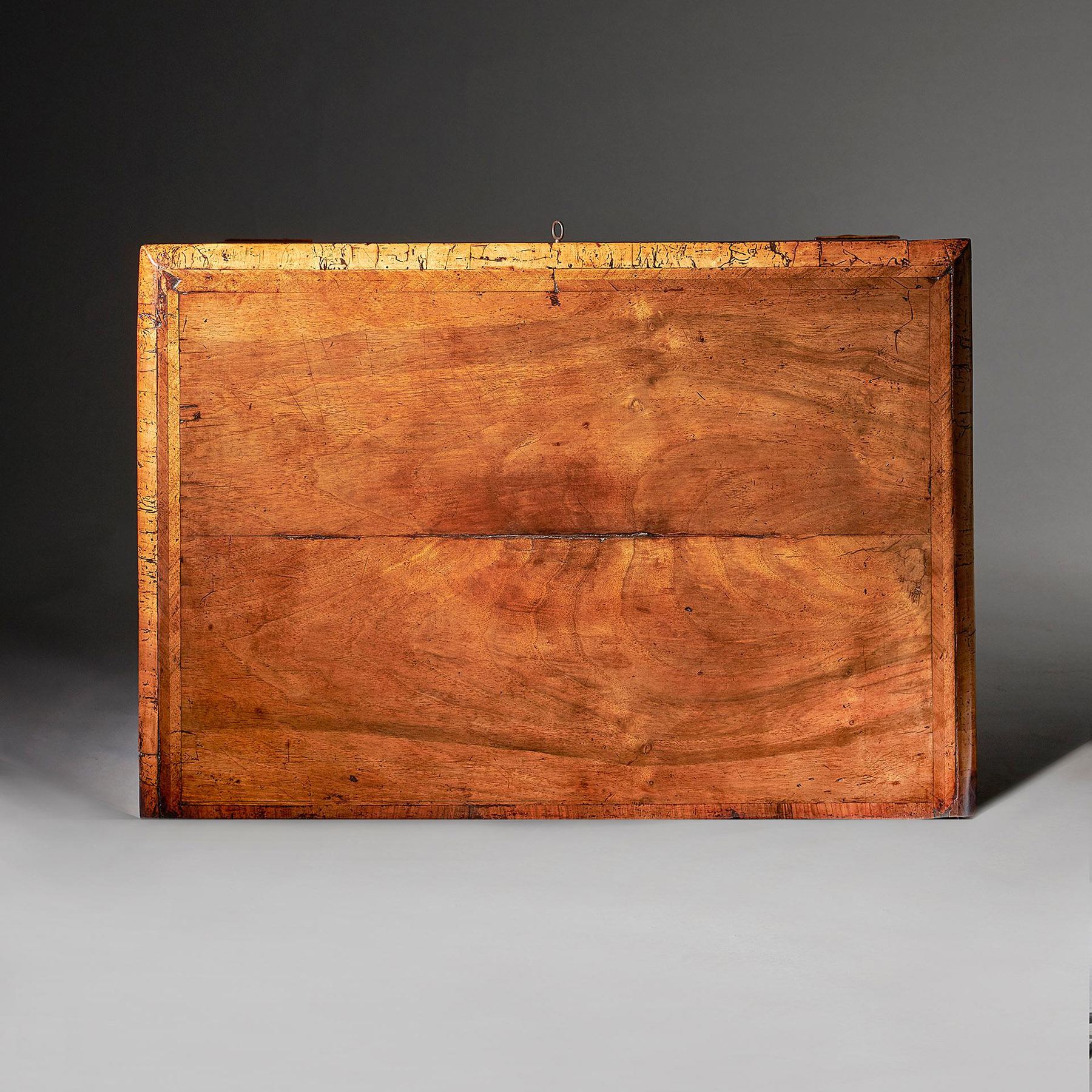 An extremely rare George I walnut chest of small proportions on ball and bracket 14