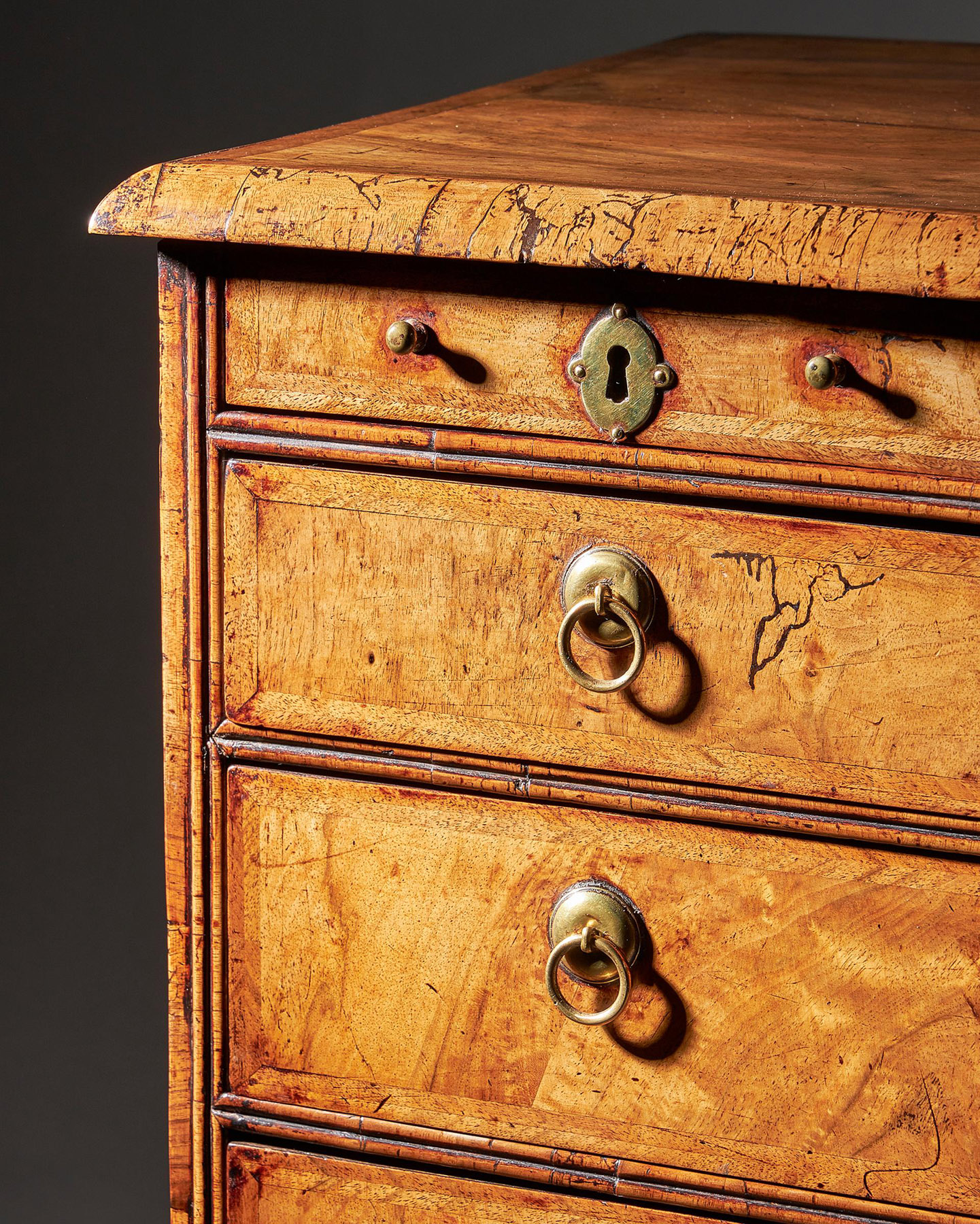 An extremely rare George I walnut chest of small proportions on ball and bracket 6