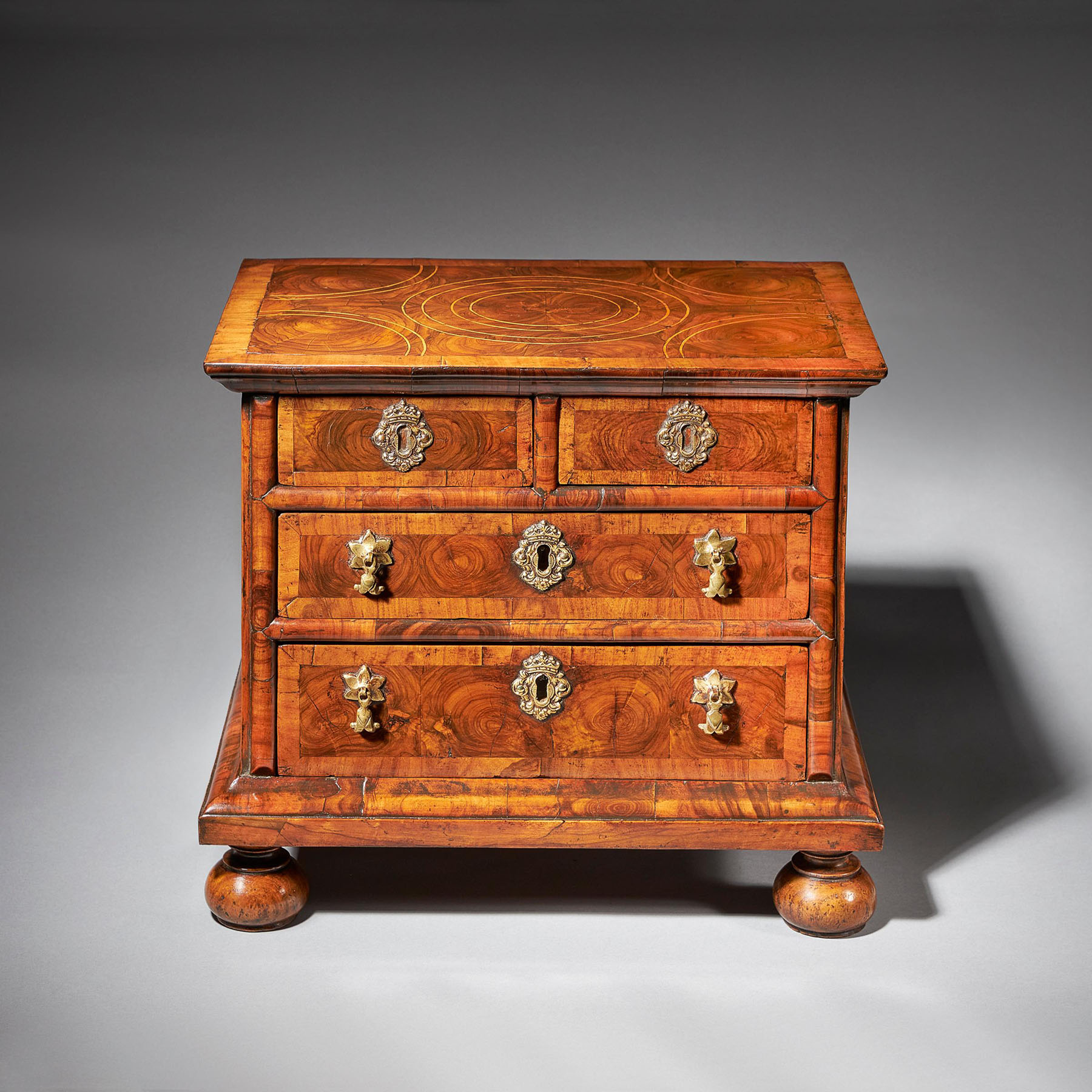 Diminutive 17th century William and Mary Olive Oyster Miniature Chest of Drawers 1