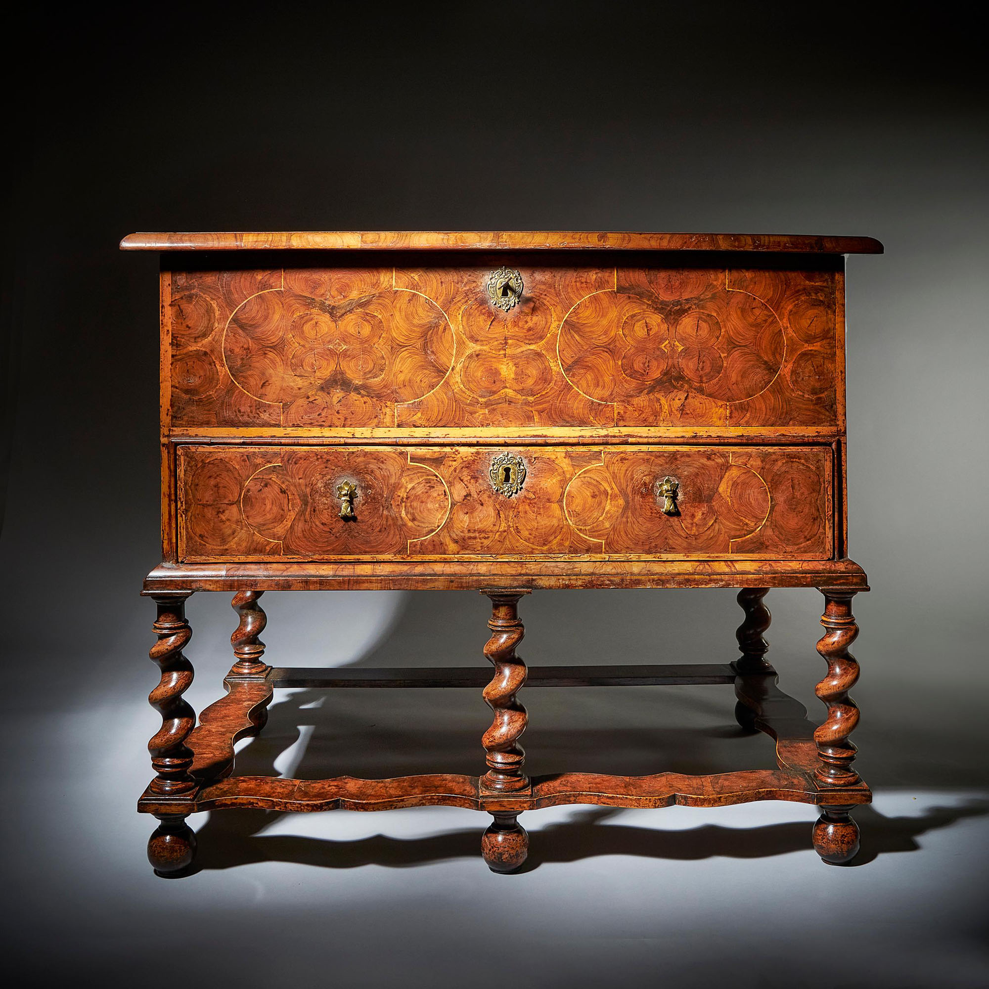 A fine and extremely rare 17th century William and Mary baroque olive oyster chest on stand or 'table box', circa 1675-1690. 1