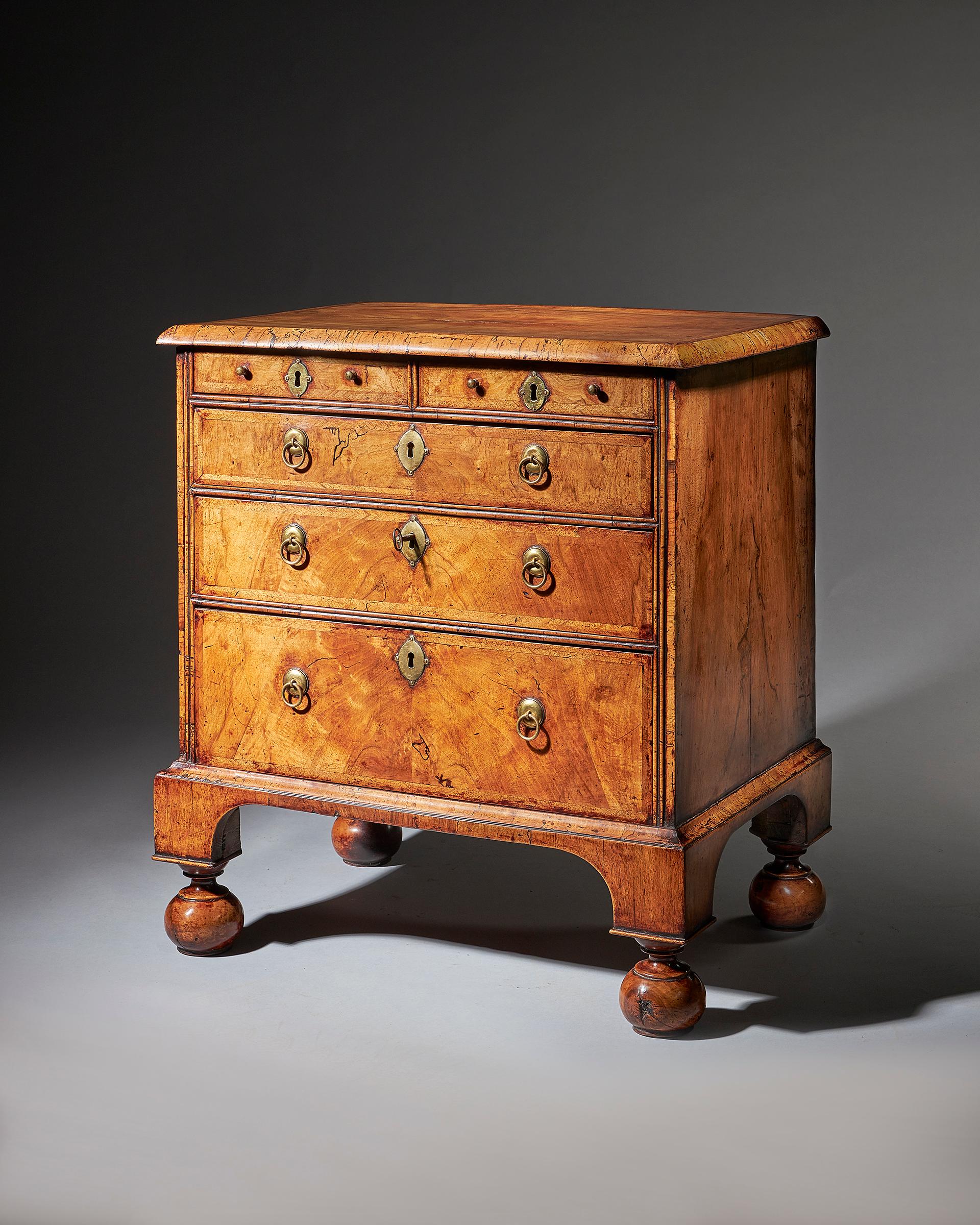 An extremely rare George I walnut chest of small proportions on ball and bracket-2